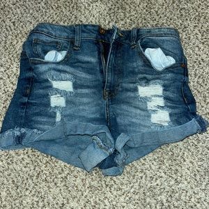 shirt blue jeans with rips on the front and size M